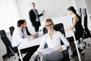 Group of happy young business people in a meeting at office
